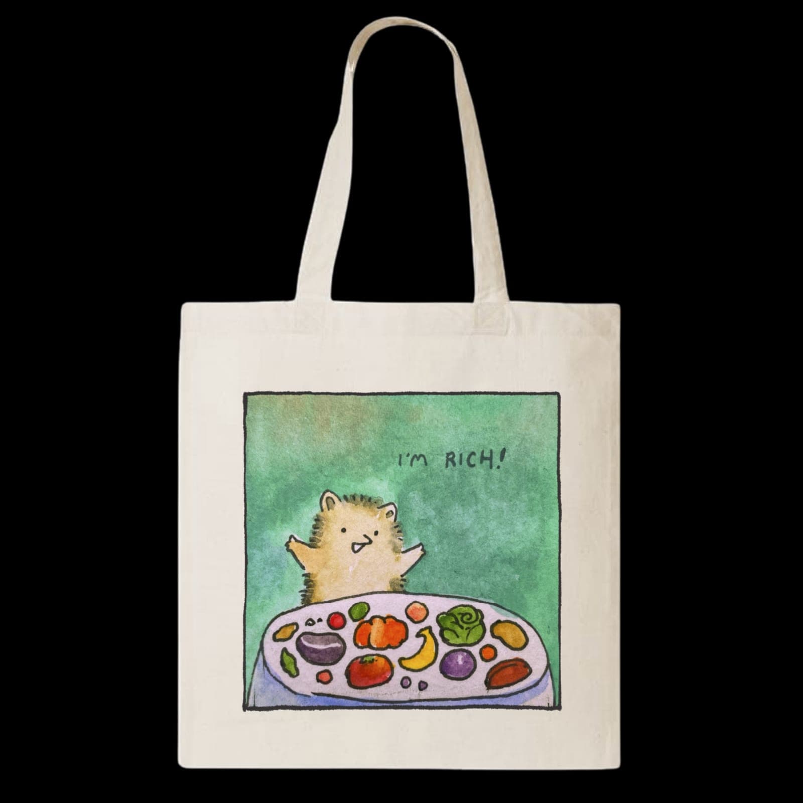 The natural canvas Gratitude tote, its printed panel showing a small round cat with both arms up behind a platter of vegetables