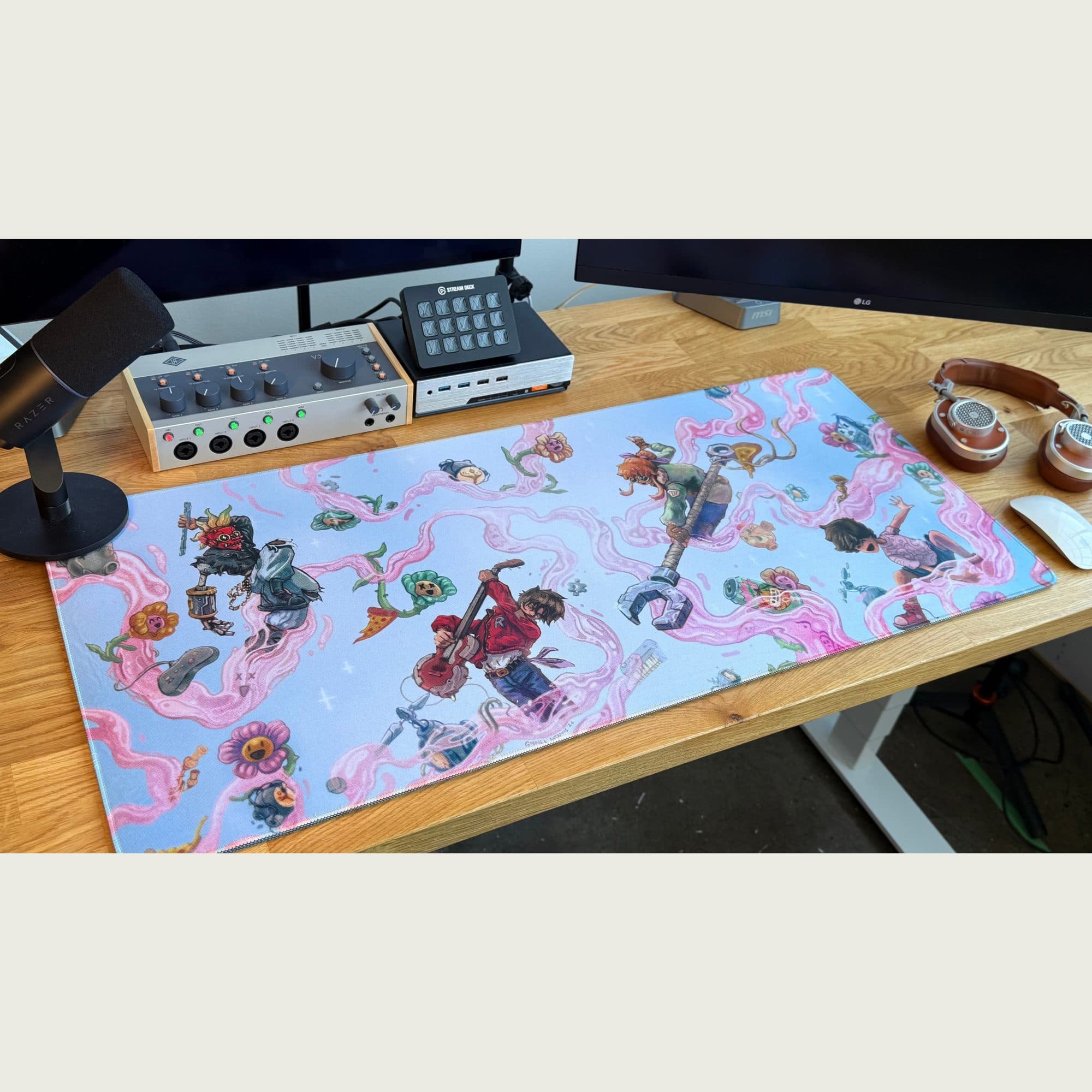 The Good Kid Entering Rift deskmat laid out on a desk with a keyboard and monitor